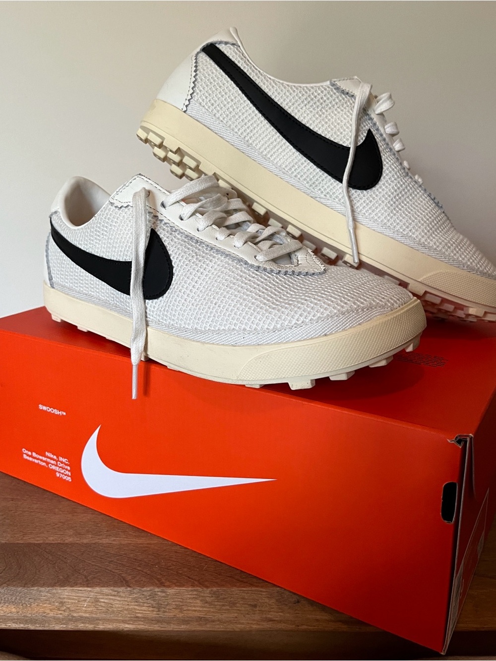 Nike Women’s White Mesh Sneakers with Black Swoosh and Cream Midsole